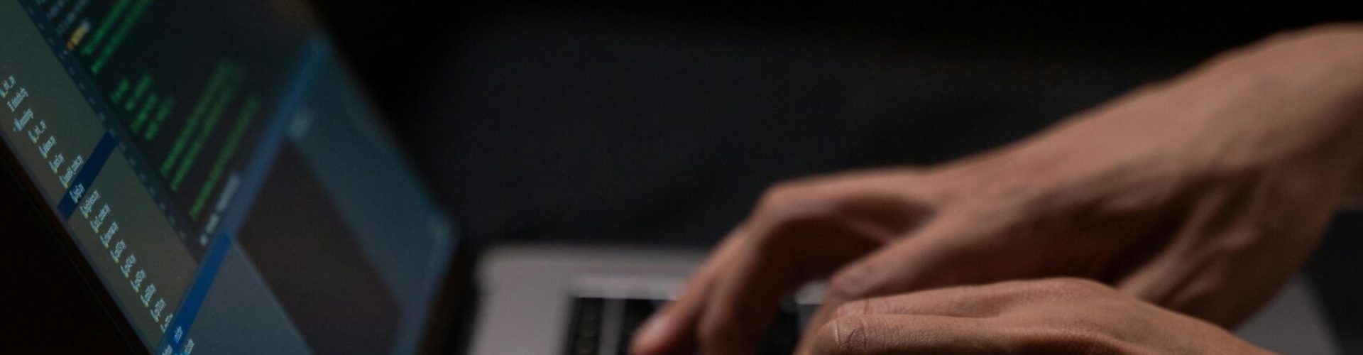 pexels-photo-5496464-5496464 Hands typing code on a laptop keyboard in a dark room, capturing the essence of late-night programming.
